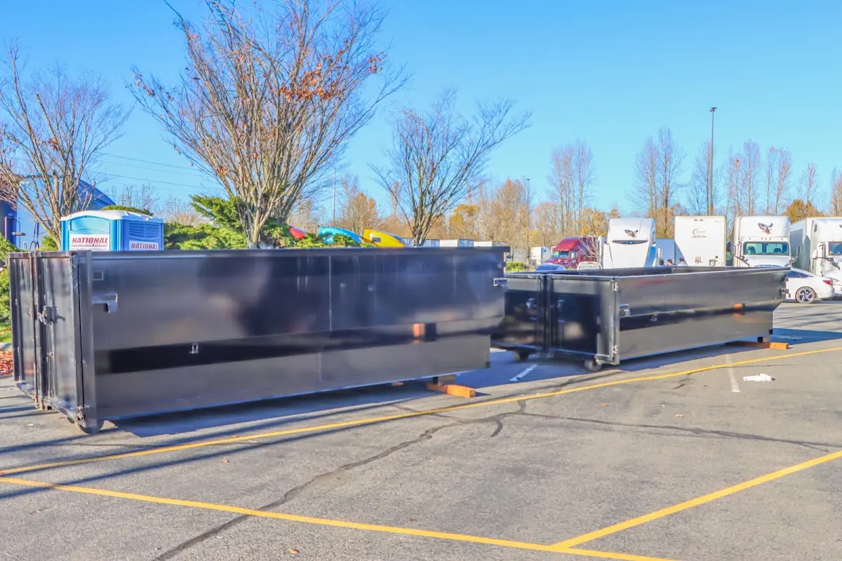 Professional dumpster rental service with roll-off container on residential driveway in Nantucket